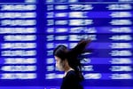 Asia stocks fall as US futures rally on tech